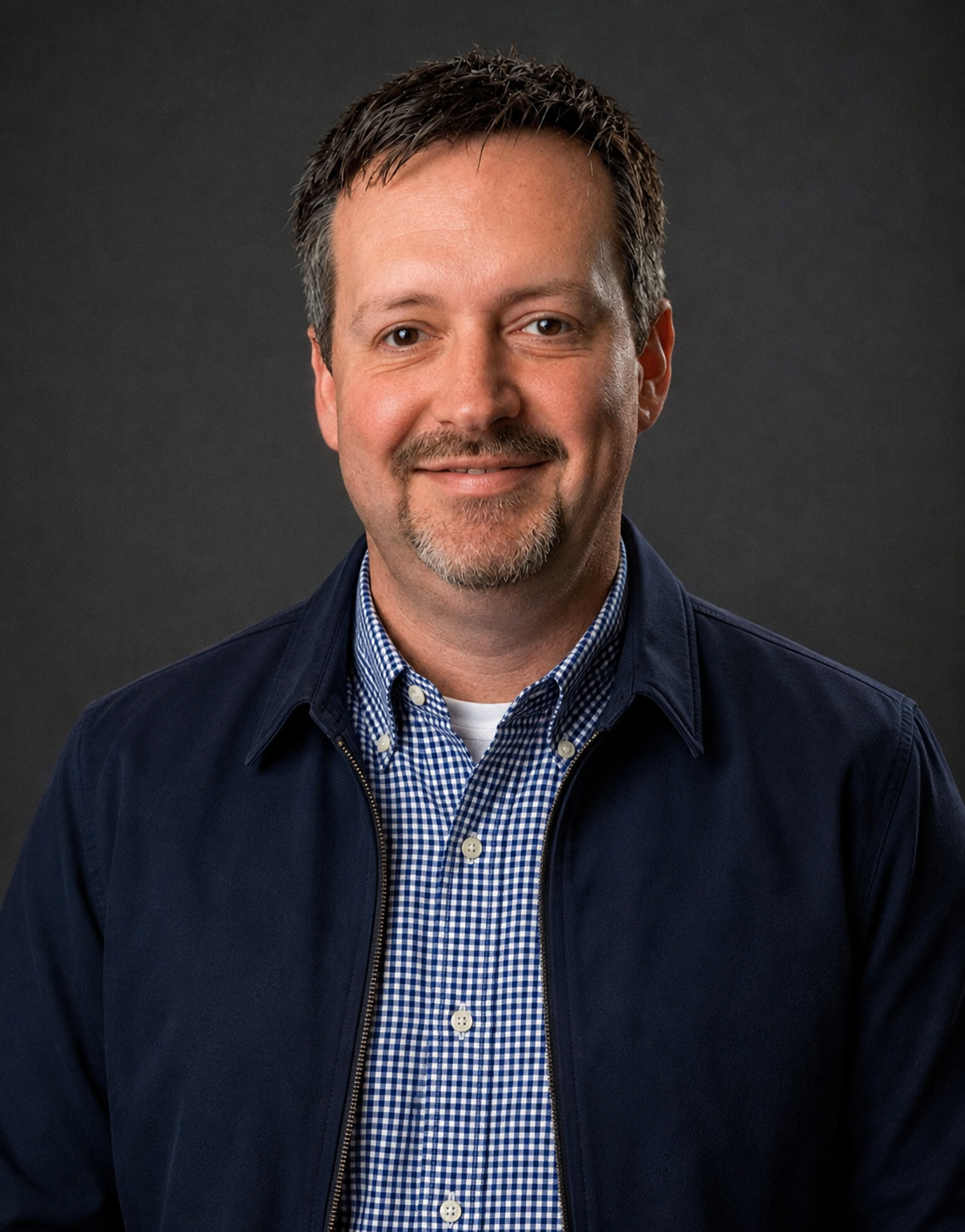 Professional headshot of Alan Cook